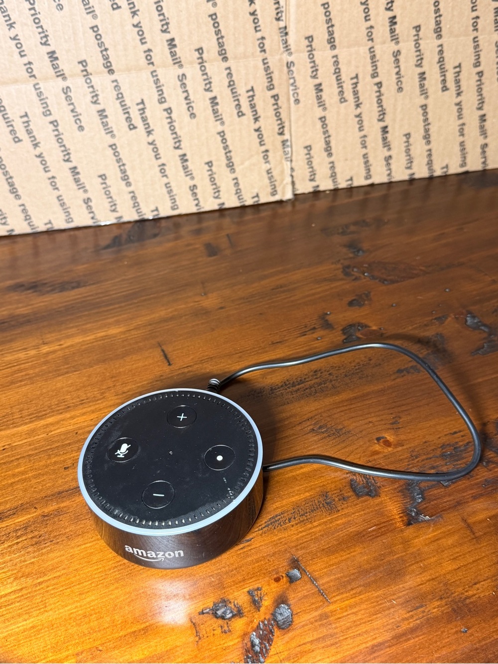 The Amazon Echo Dot 3rd Gen Smart Speaker in Black is a sleek and modern